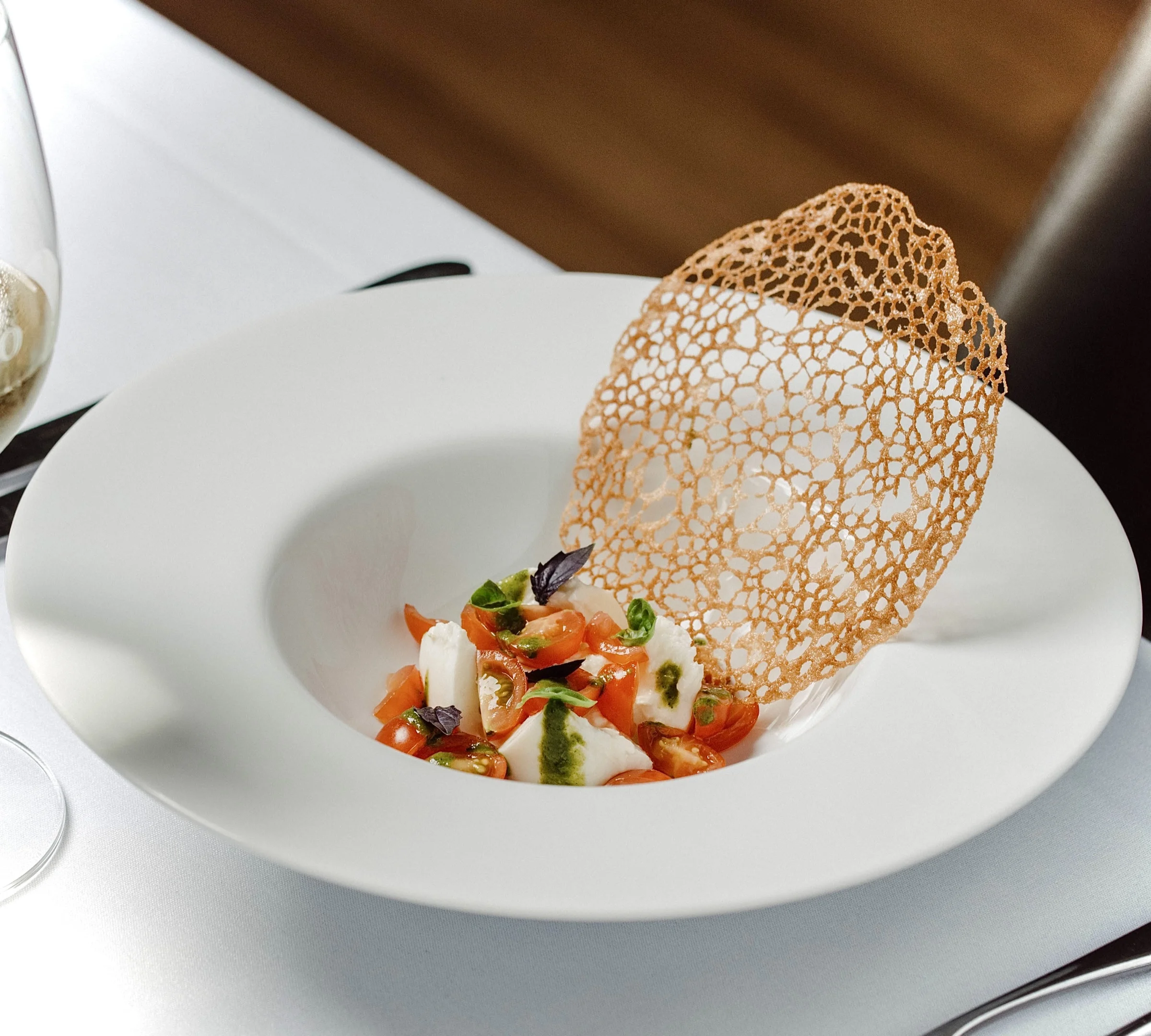 Heritage tomatoes, burrata, bread tuile by Sicily Chef