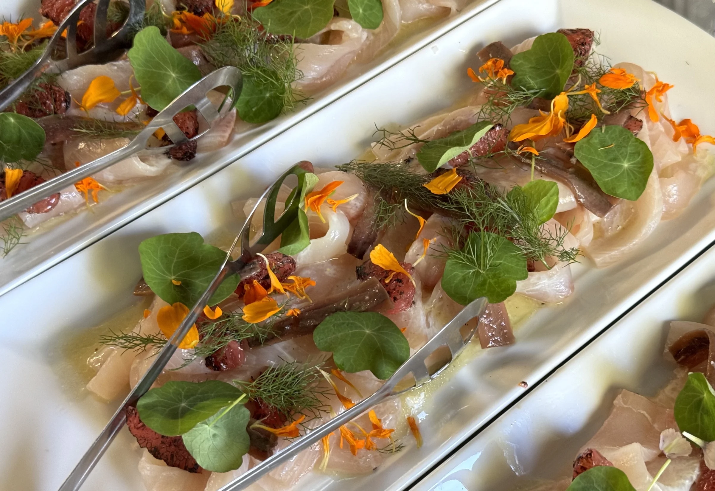 Seabass crudo, Cantabrian anchovies and burnt grapefruit by Sicily Chef